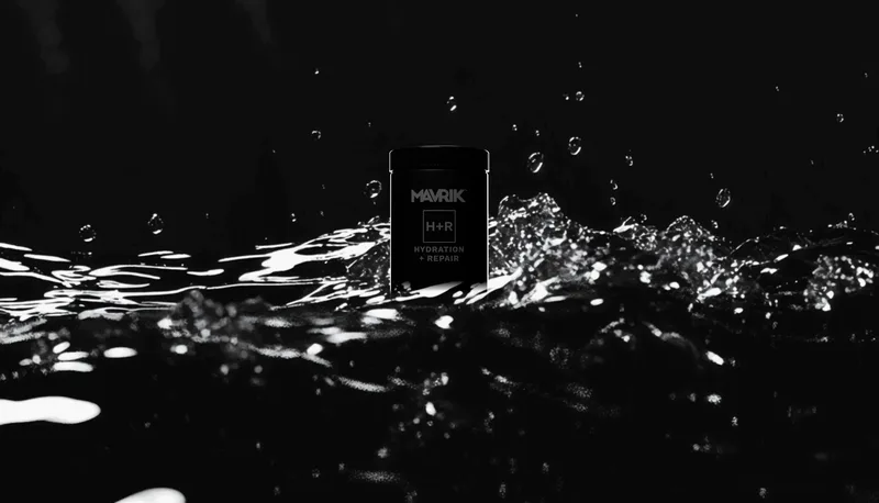 Preview render of the MAVRIK Hydration + Repair canister in dark, splashing water